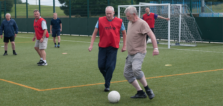 Older men playing walking football