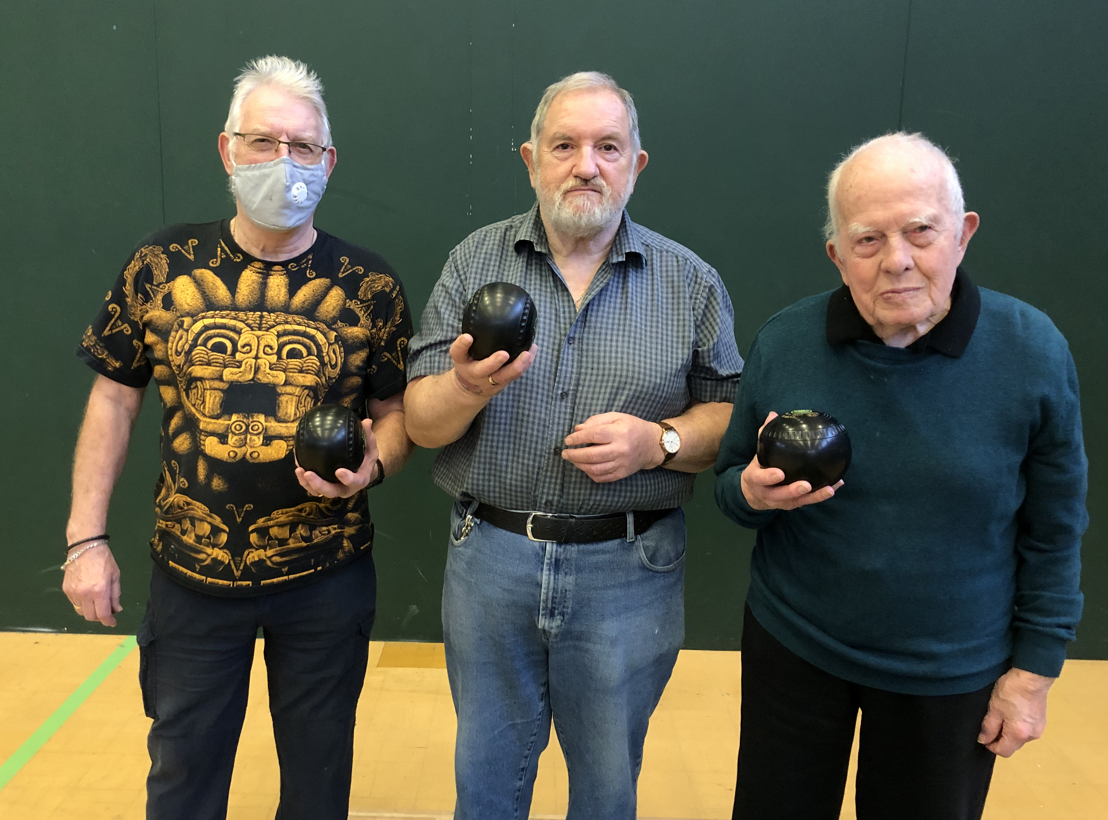 3 men holding bowling balls