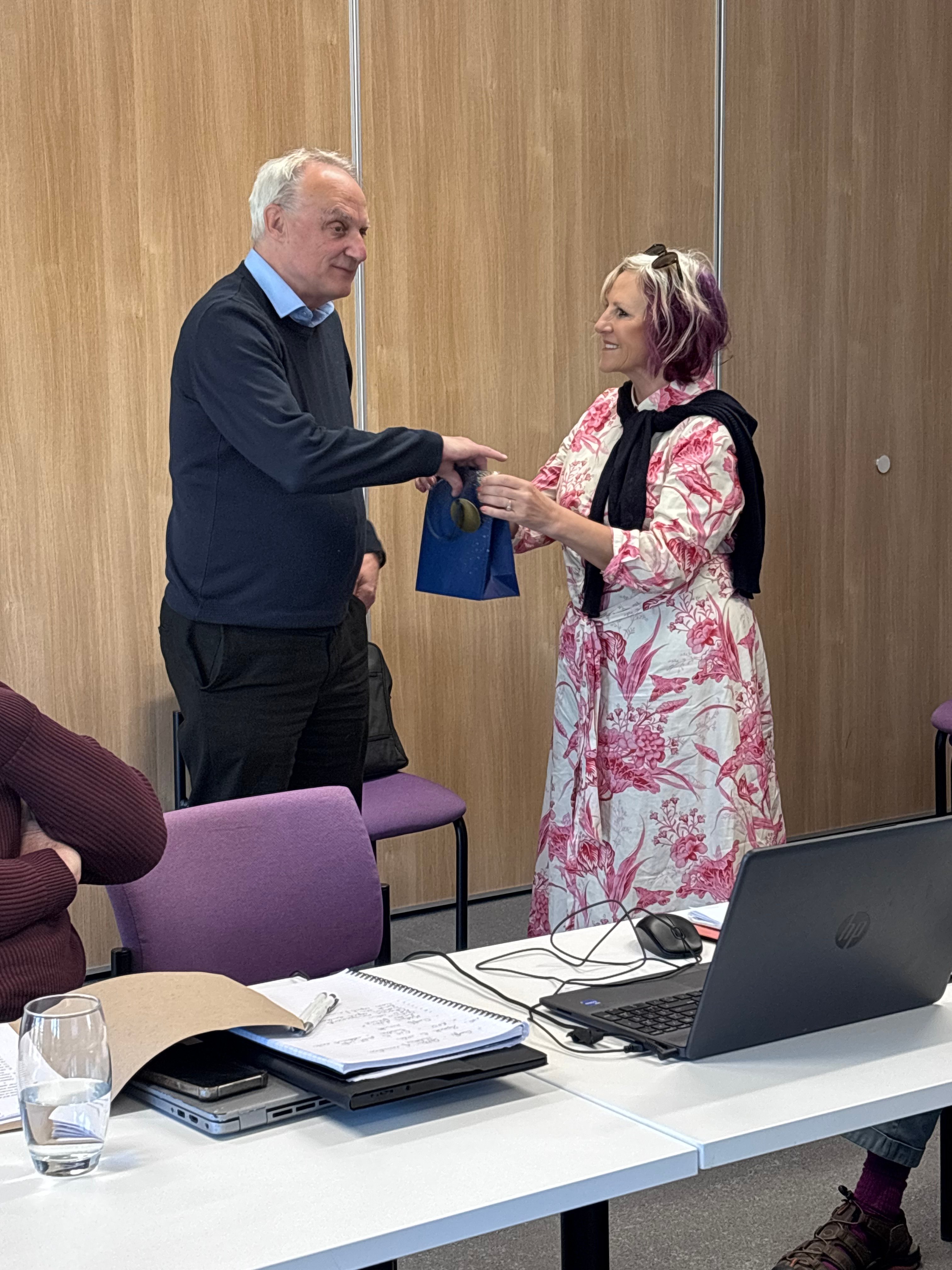 Alan receiving a gift