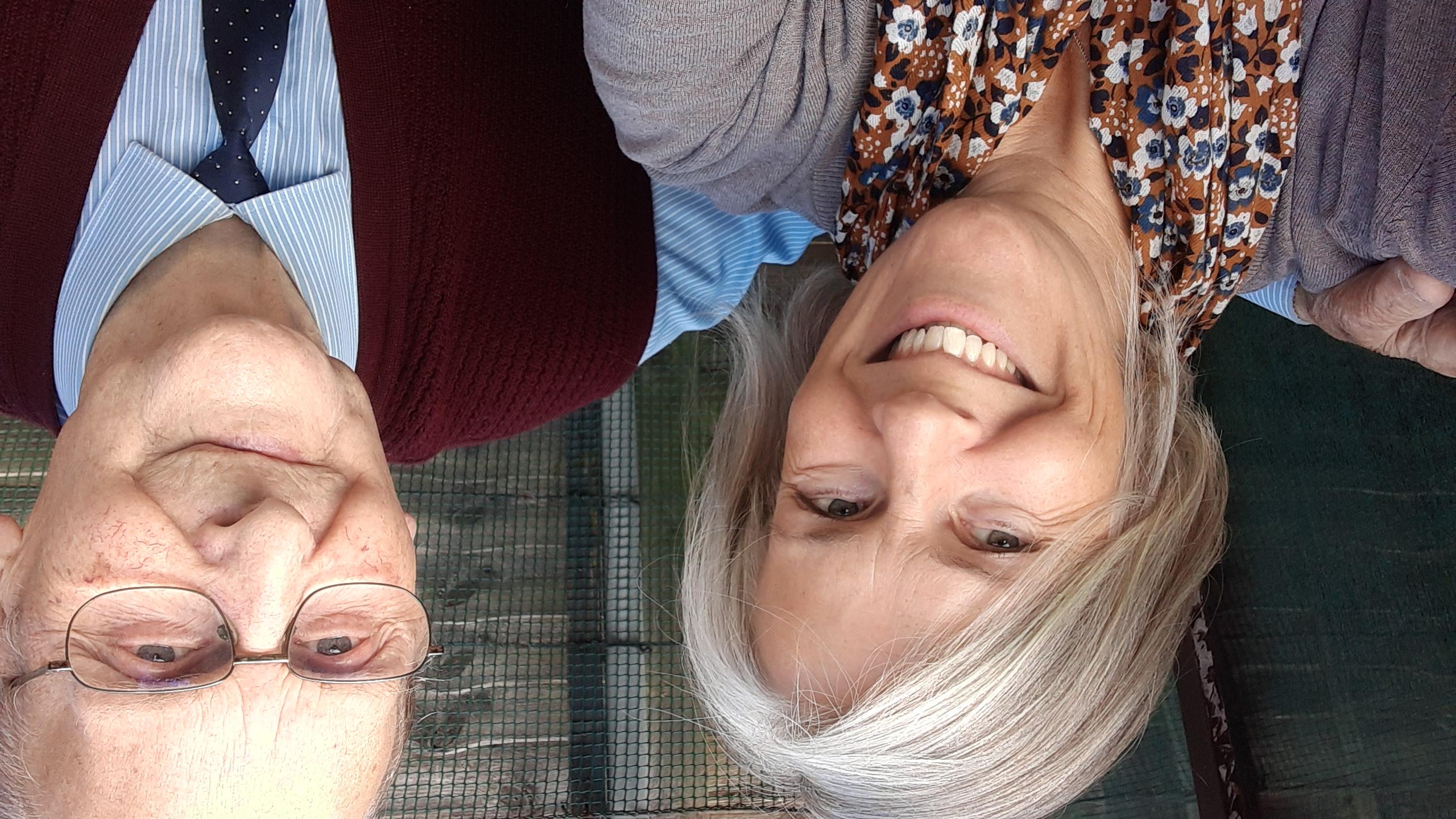 Head and shoulders selfie image of Helen and Bryan smiling at the camera.