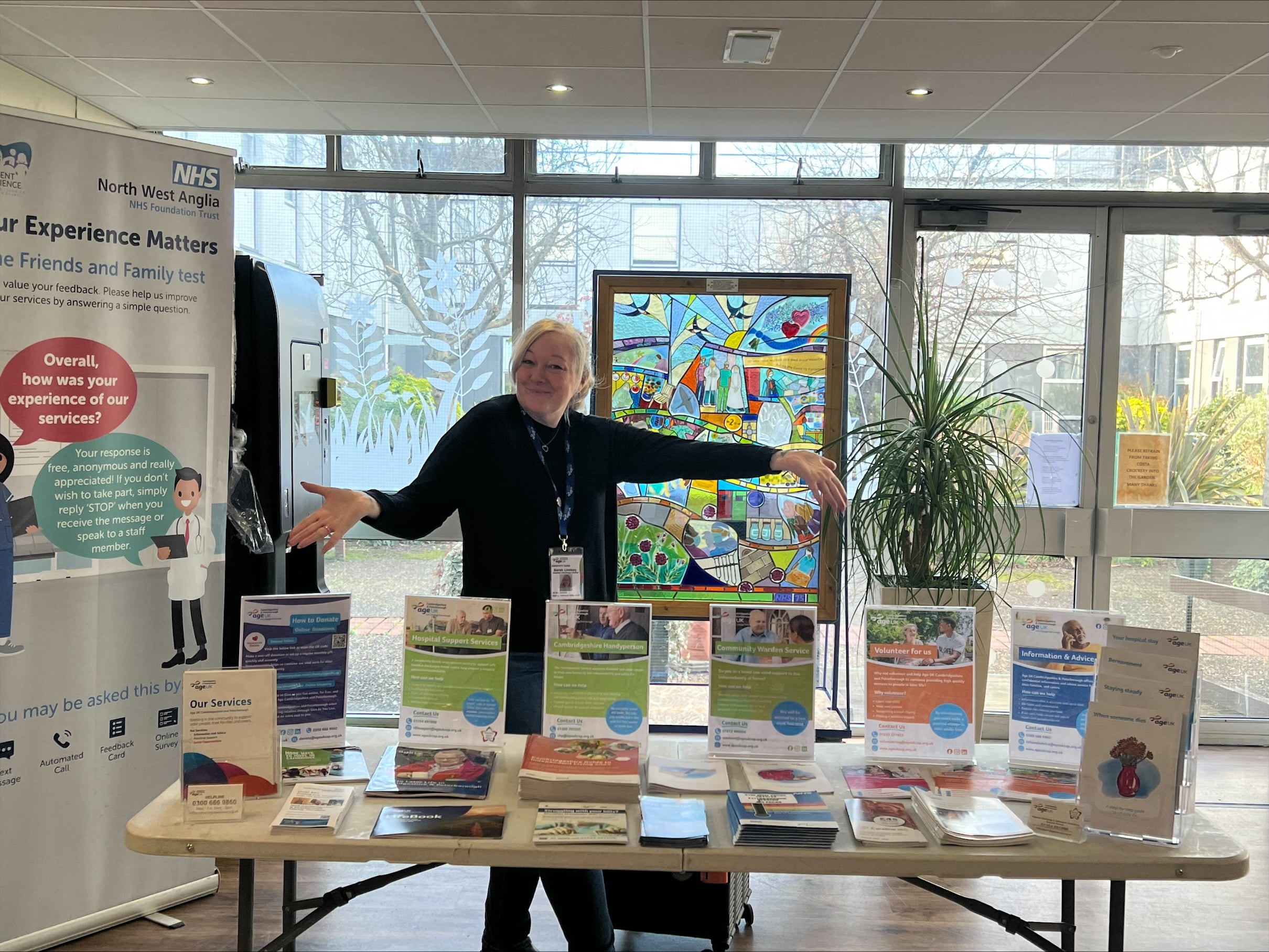 Age UK CAP employee with promotion display