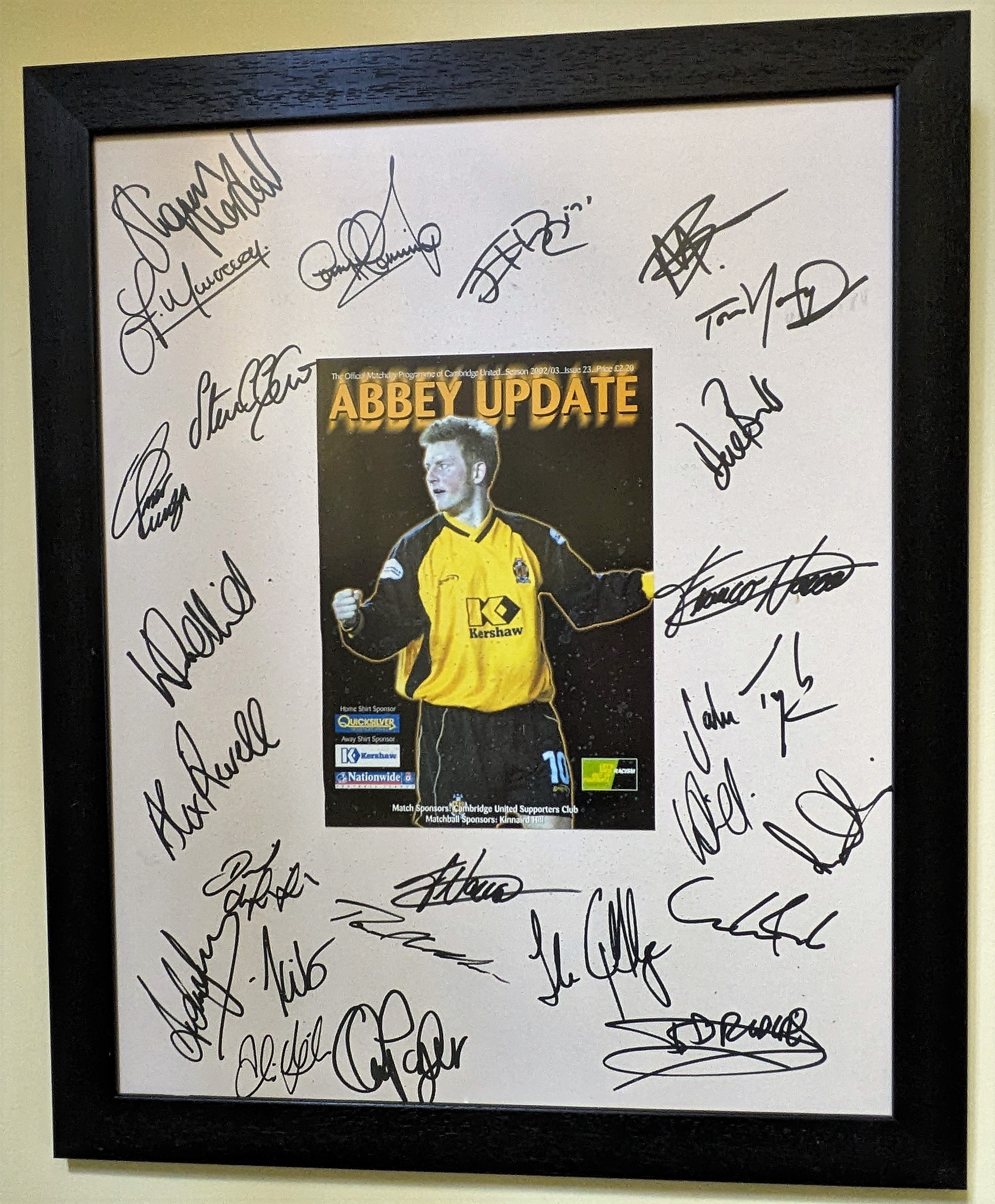 Close up photo of the framed retirement gift showing the players signatures