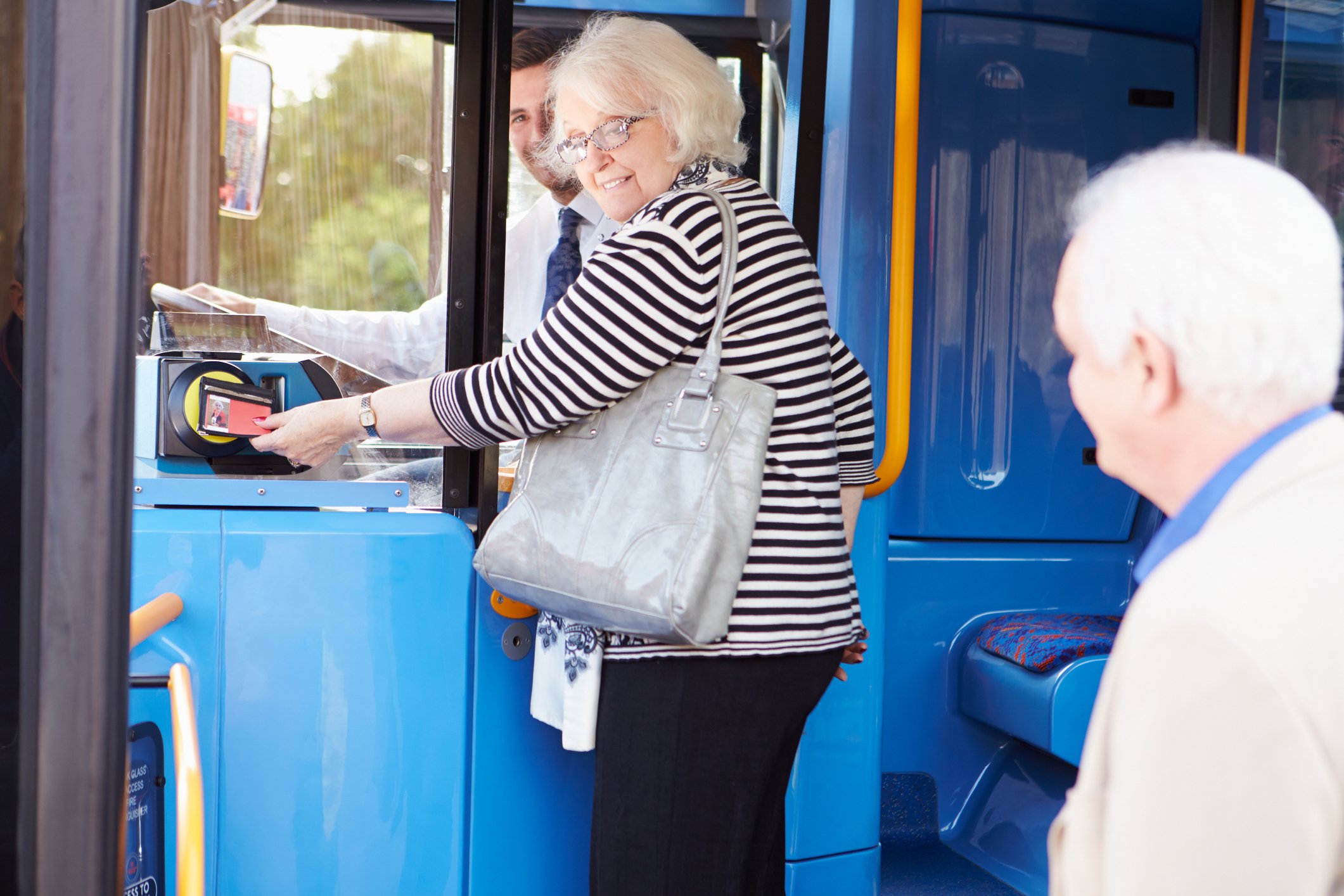 Two older people on a bus