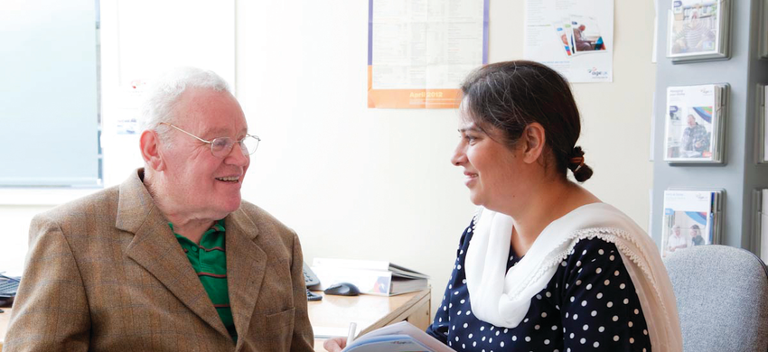 Woman helping man with advice