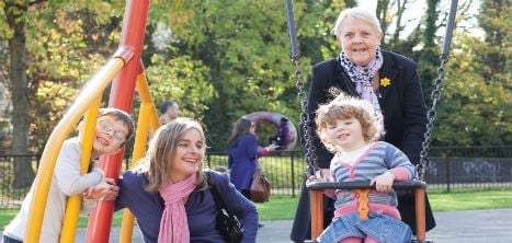 Older woman in park with family