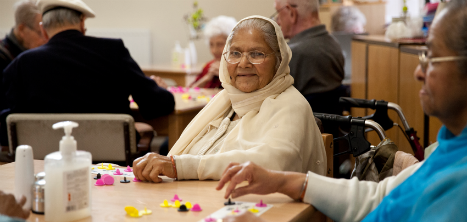 Volunteer with older people at Age UK Barnet activity