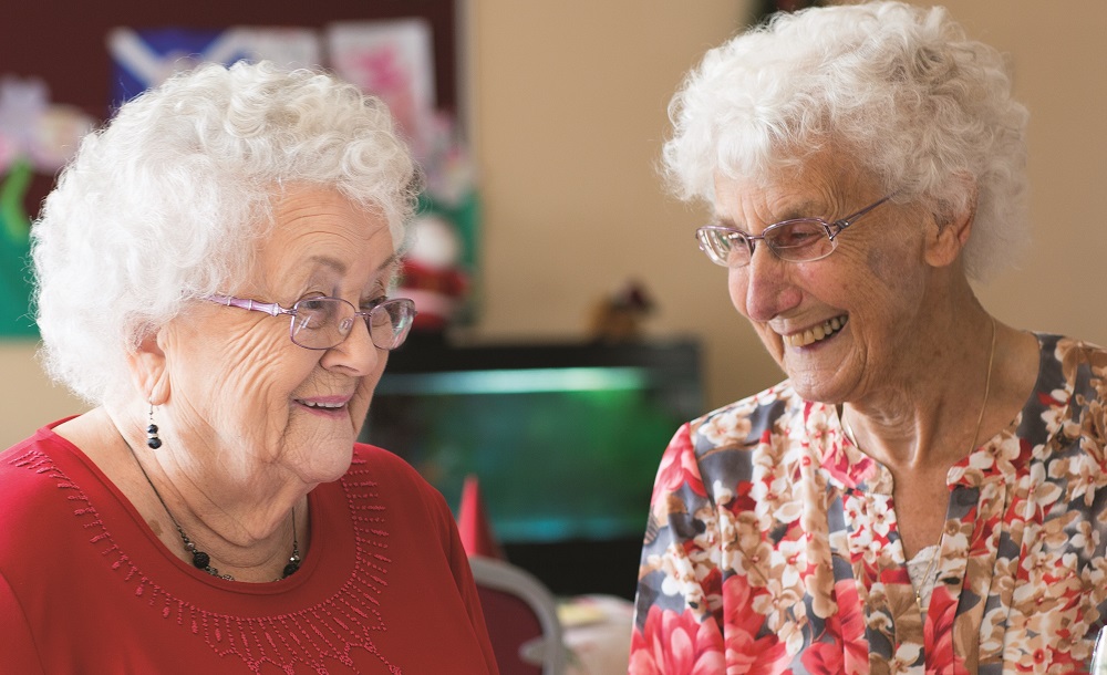 Two women talking at dementia group