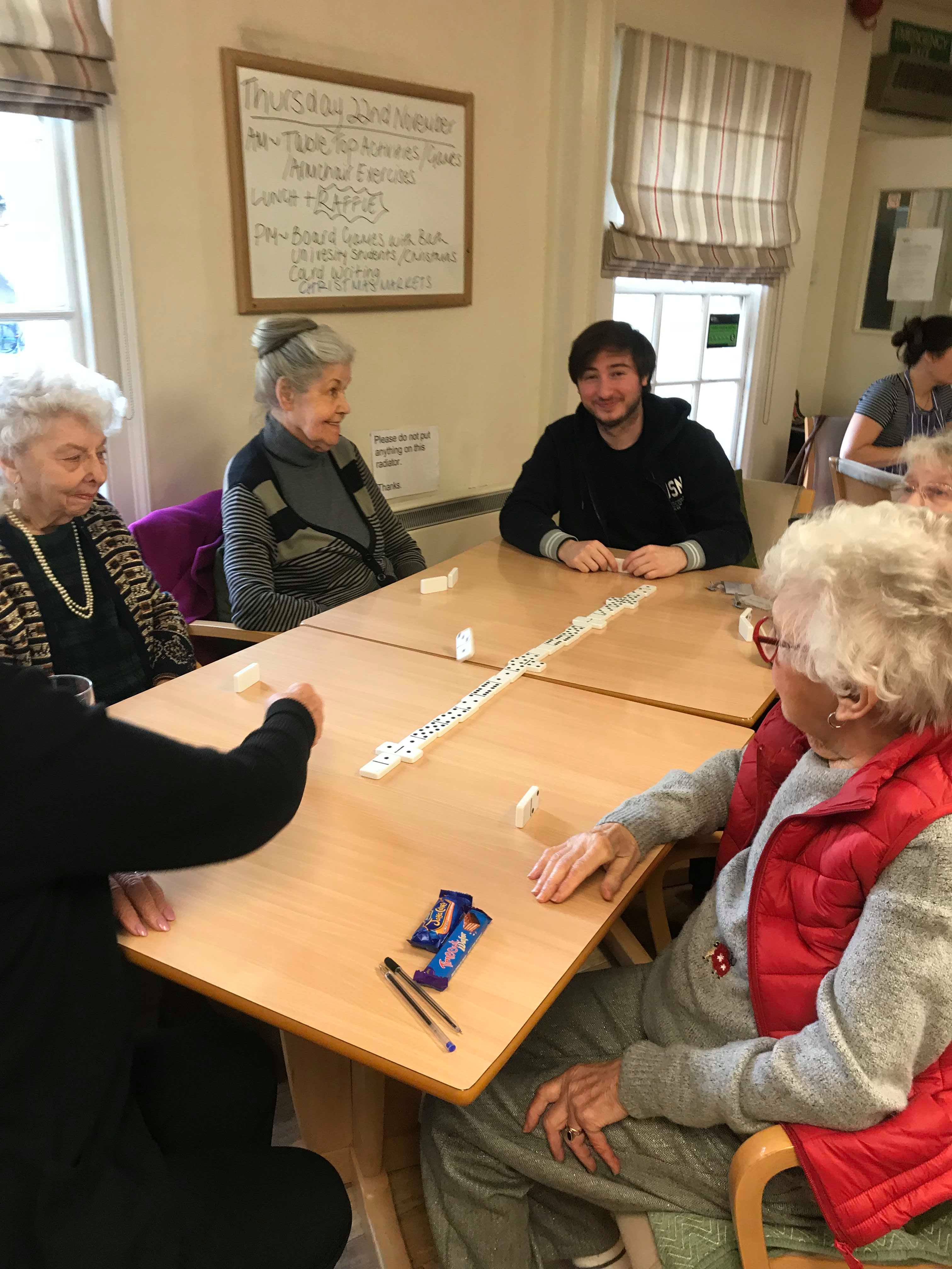 Student at Bath Day Centre playing dominoes