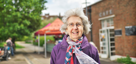 Woman standing outside in a scarf