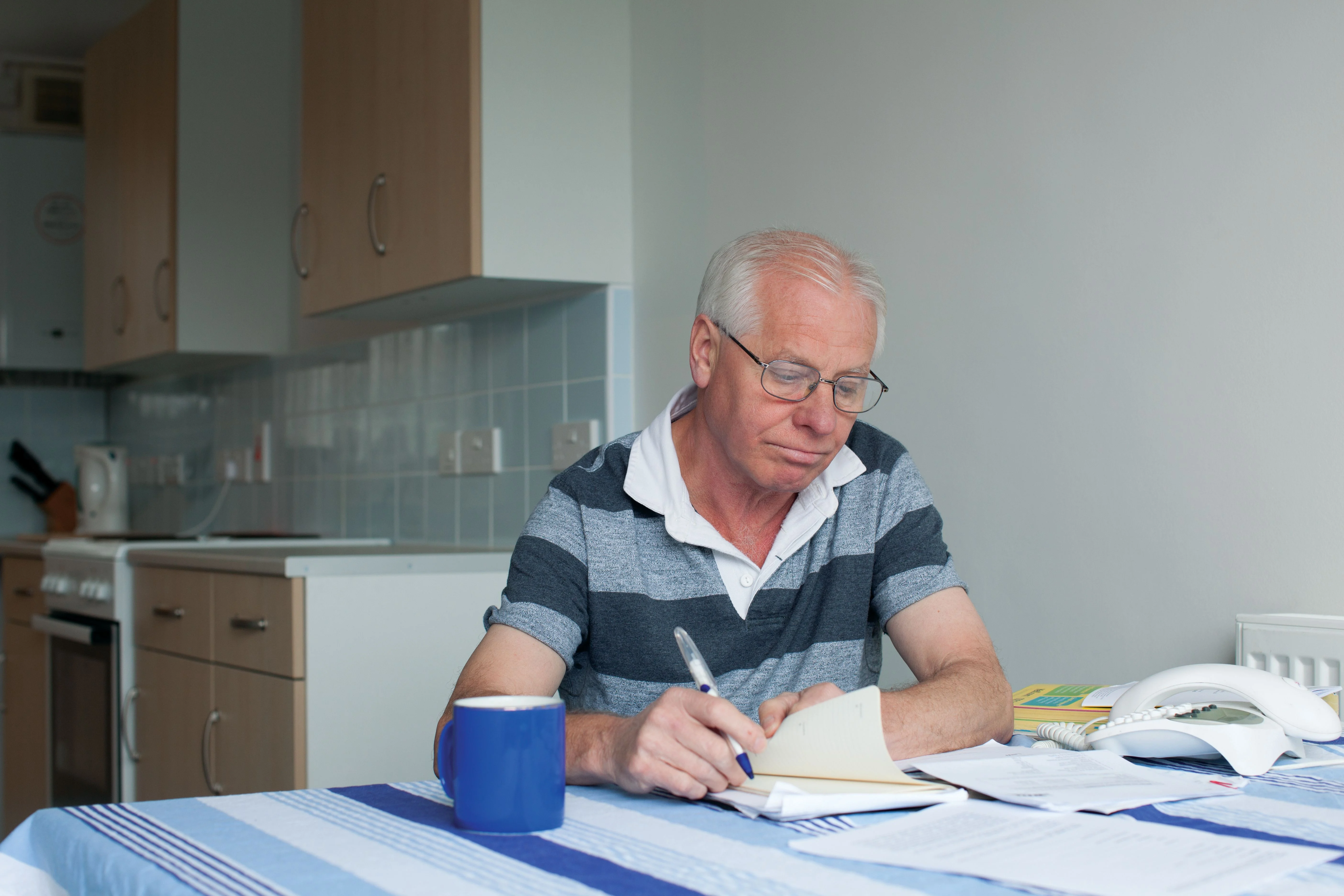 Man writing at home