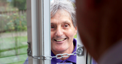 doorstep trader behind safety bolt on door