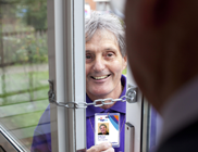 doorstep trader behind safety bolt on door