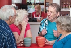 people discussing in a cafe