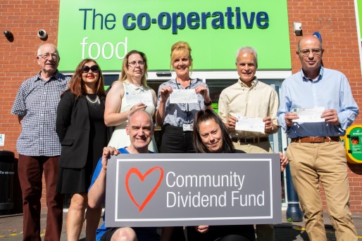 Receiving the cheque from the co-op