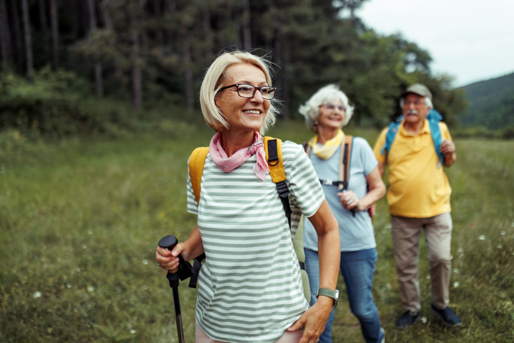 Older adults enjoying gentle exercise outdoors, promoting healthy ageing