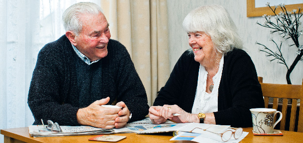 picture of older man and woman looking at paperwork