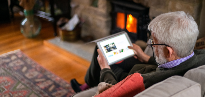 Man using a tablet device at home