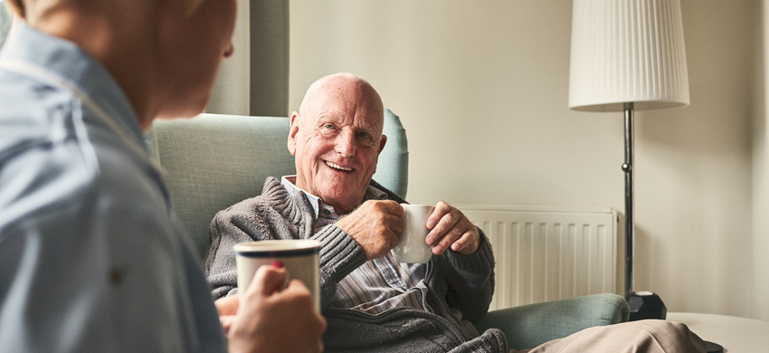 Age UK Herefordshire & Worcestershire | The Social care cap - image of a nurse and an older man