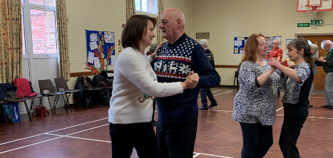 Couples dancing at a dance school. Image was taken pre-covid.