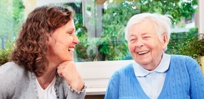 Older person and younger person seated