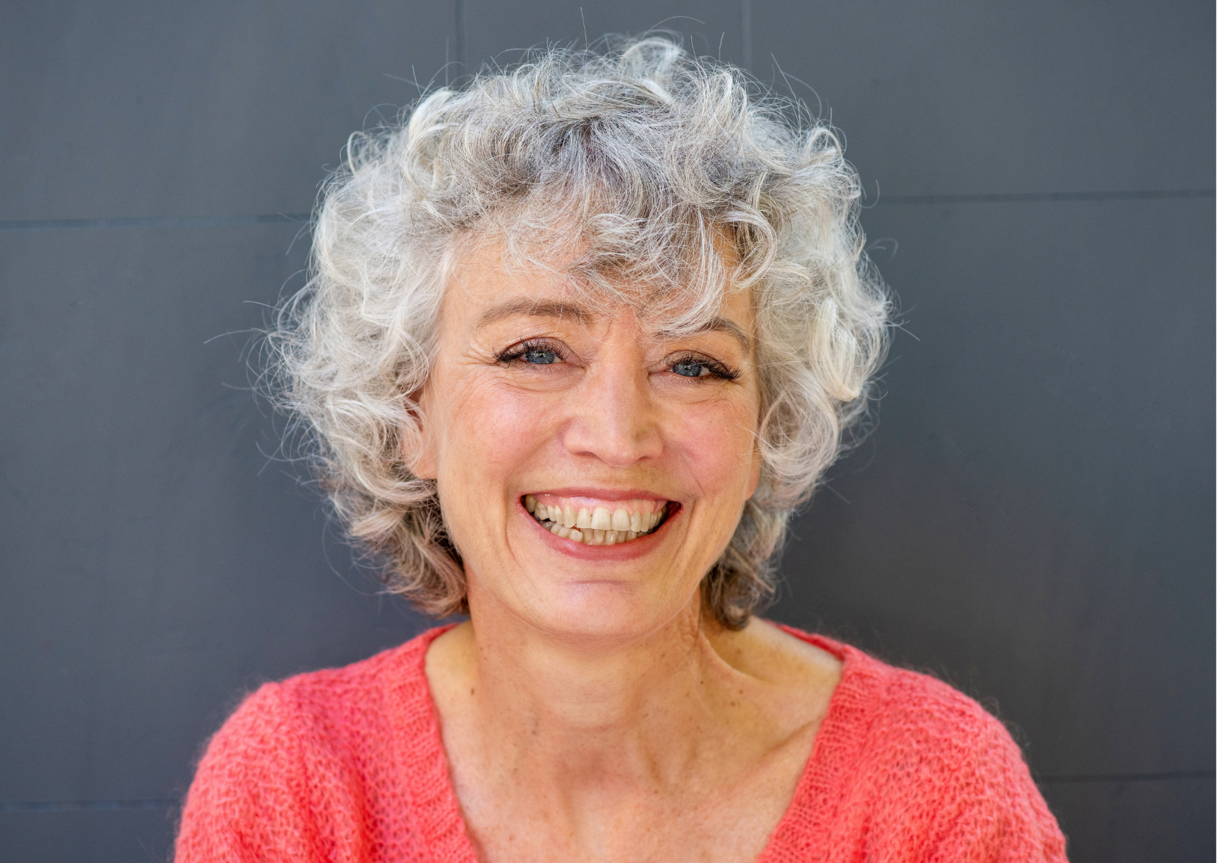 Lady with grey hair smiling