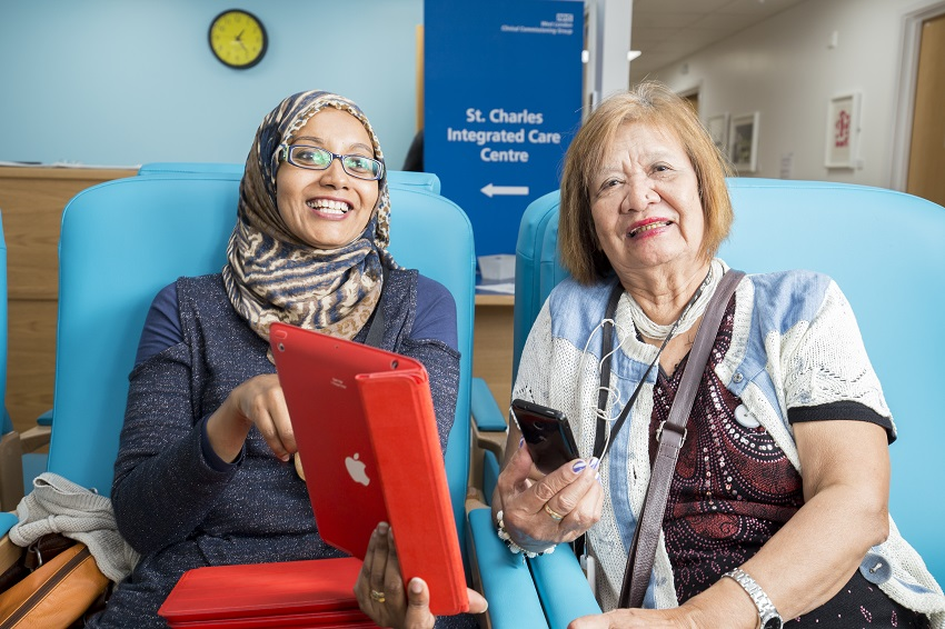 Female patient with NHS member of staff in St Charles Integrated Care Centre