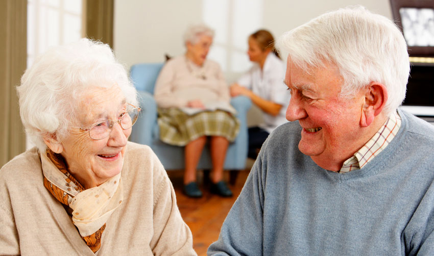 Two older people enjoying a day care group