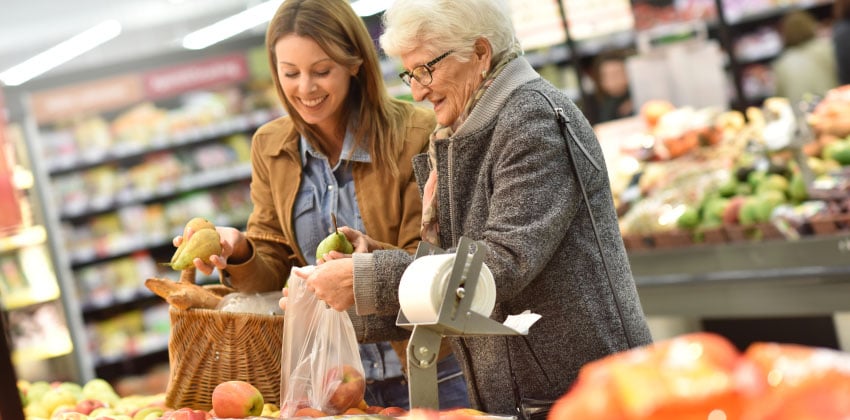 An older woman and her personal assistant out shopping