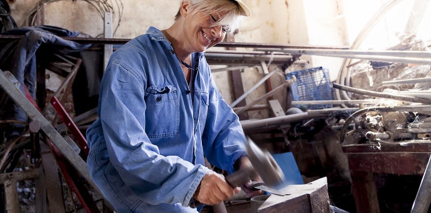 Take a look how our Women in Sheds project can help you A woman working on a project in a workshop