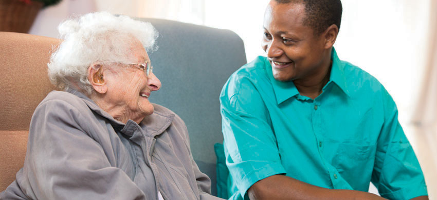 An older woman chatting with a younger friend