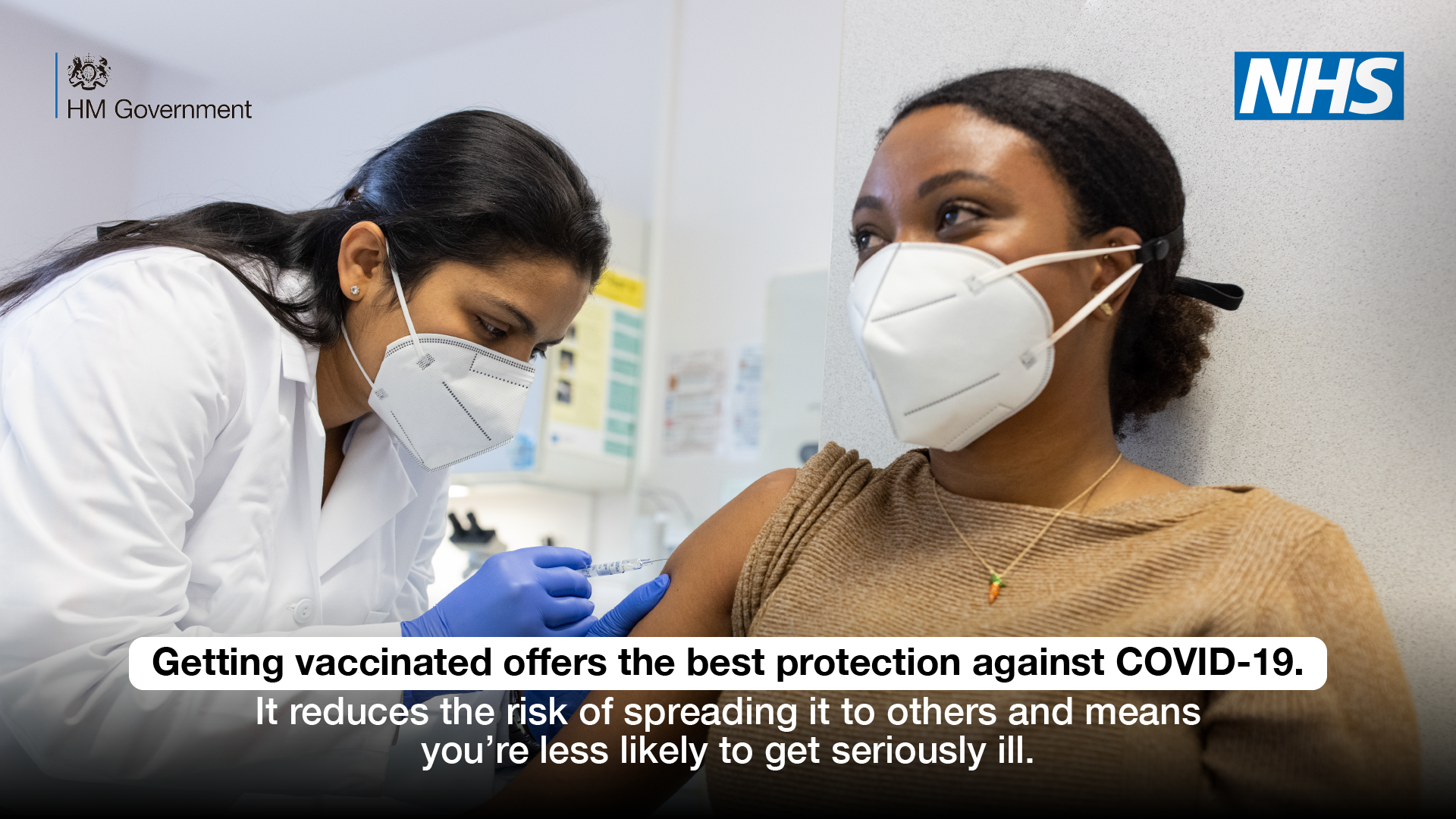 woman receiving a vaccine from a nurse