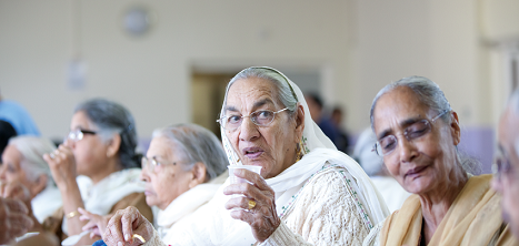 An older woman eating lunch