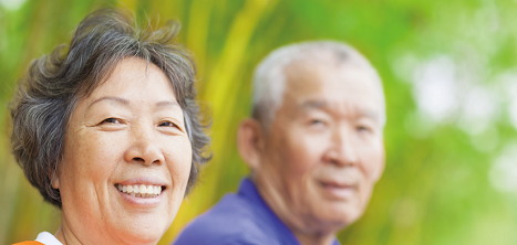 An older man and an older woman smiling.