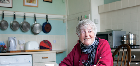 An older woman in her kitchen.