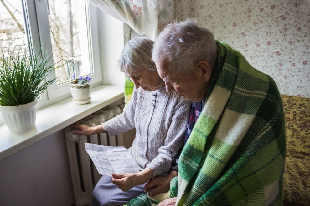 Older couple looking at a bill