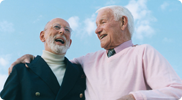 two older people smiling