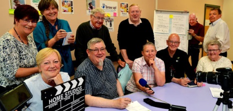 A group of community reporters, posing for a photo. 