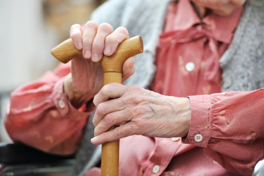 Elfderly person holding walking stick