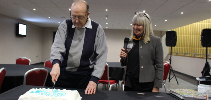 Birthday boy John cuts the celebratory cake