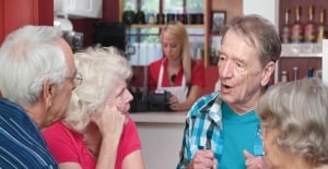 Group of older volunteers talking together