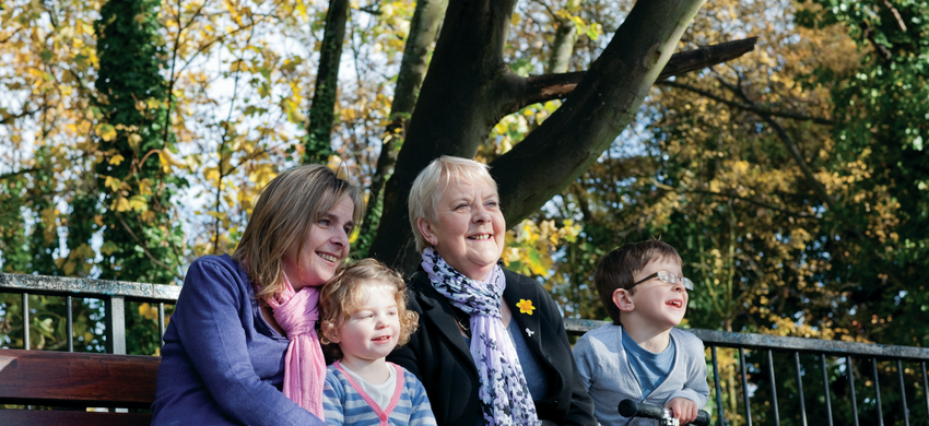 Family with older person and children in the park