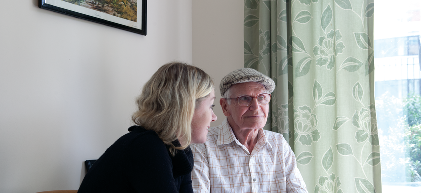Young woman advising older man
