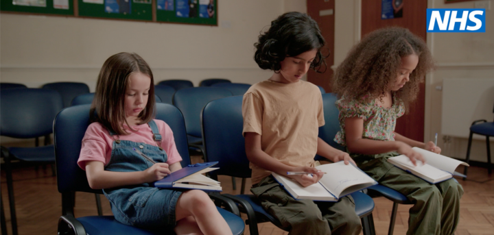 Three children in a GP waiting room