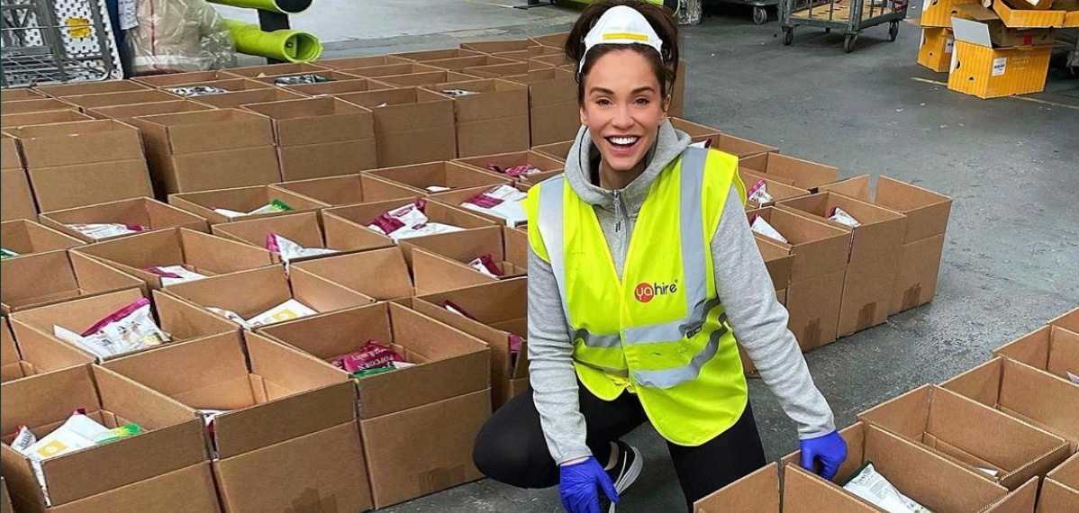 Vicky Pattison helps to pack the food boxes