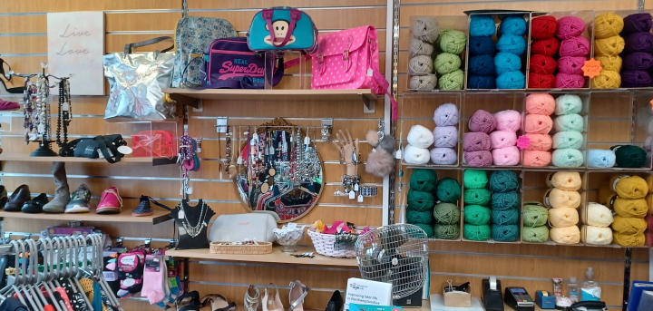 We sell clothes, toys, DVDs and wool.