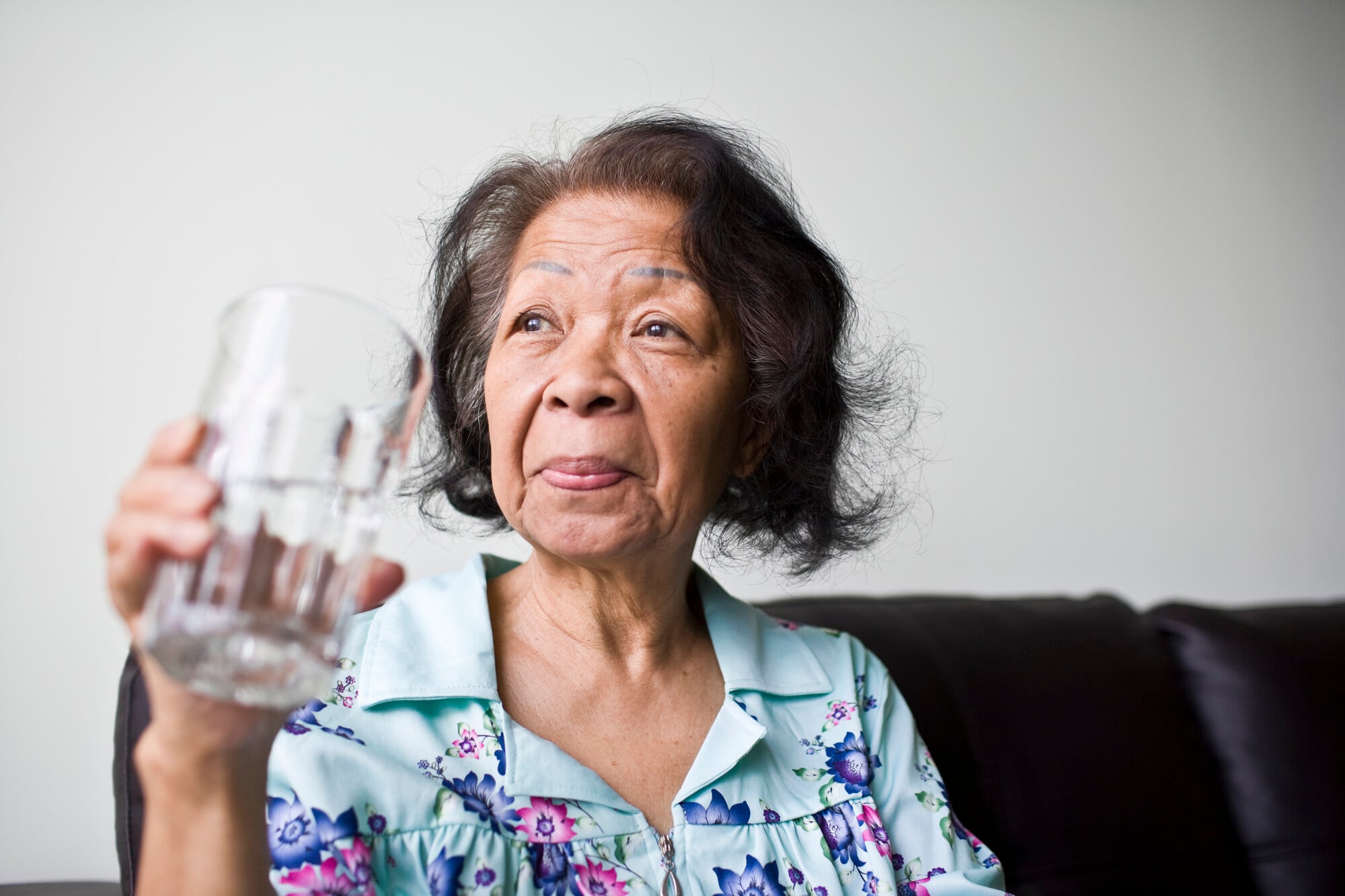 woman drinking in later life