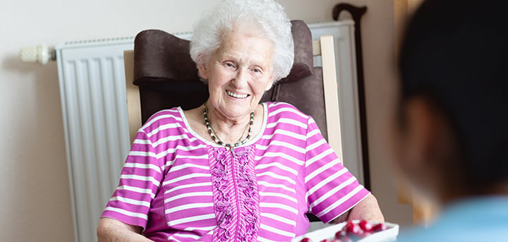 Older woman sat in chair