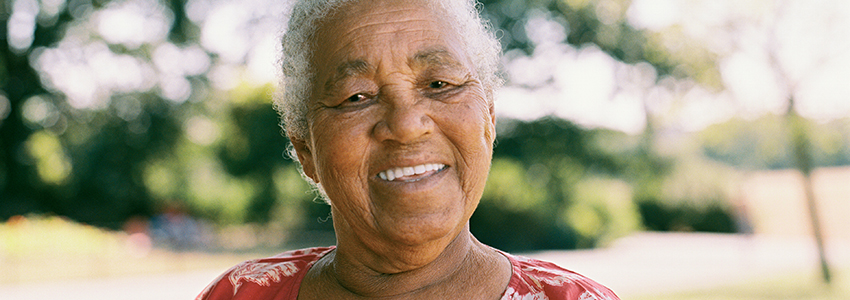 An older lady smiling at the camera