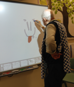 Dennis playing with the interactive white board