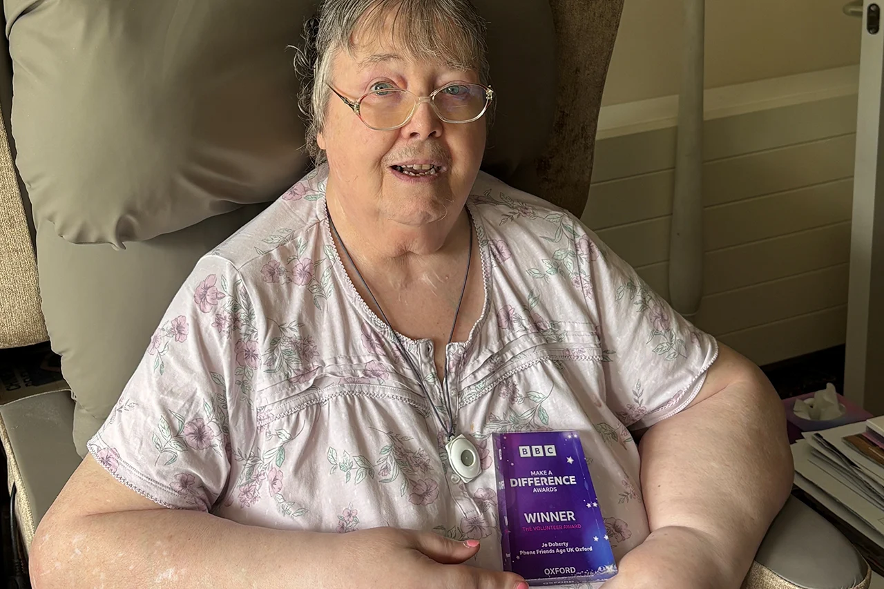 Volunteer, Jo Doherty holding BBC Make A Difference Award trophy